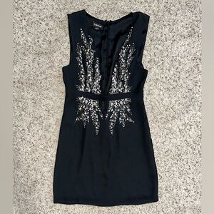 Bebe Women’s Black Plunge Neckline Dress with Rhinestone Embellishments. Size 6.